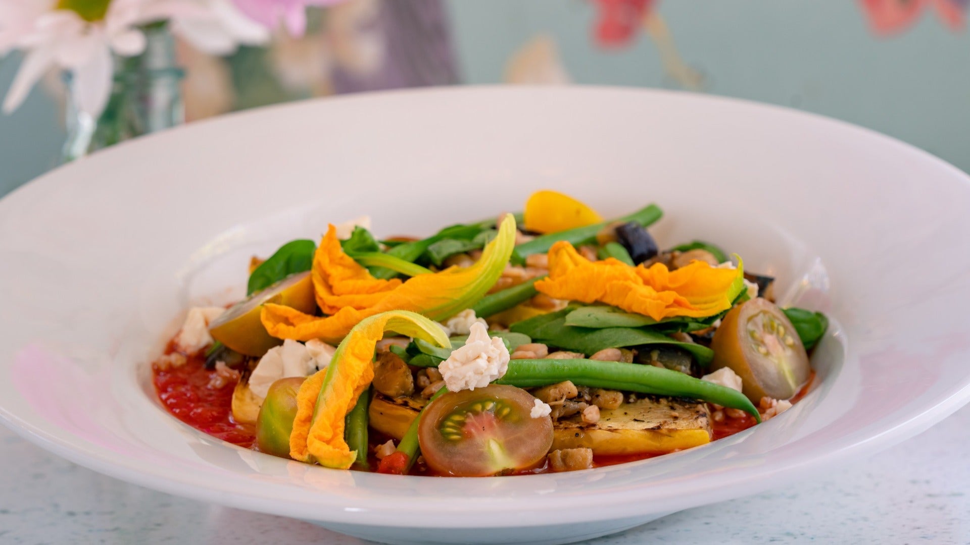 mix of veggies with sauce served on a plate